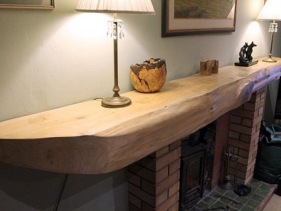 Cypress mantle piece polished to a tactile smooth finish